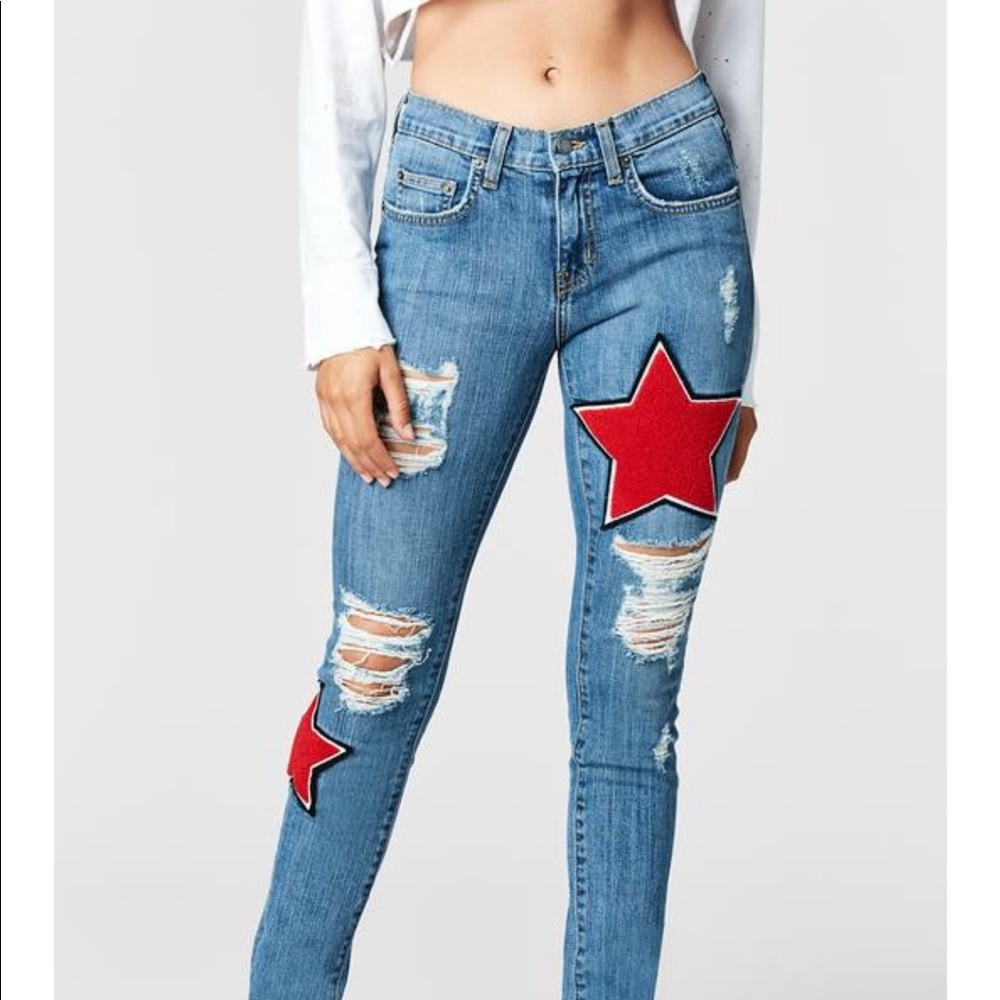 Carmar jeans with red star patches